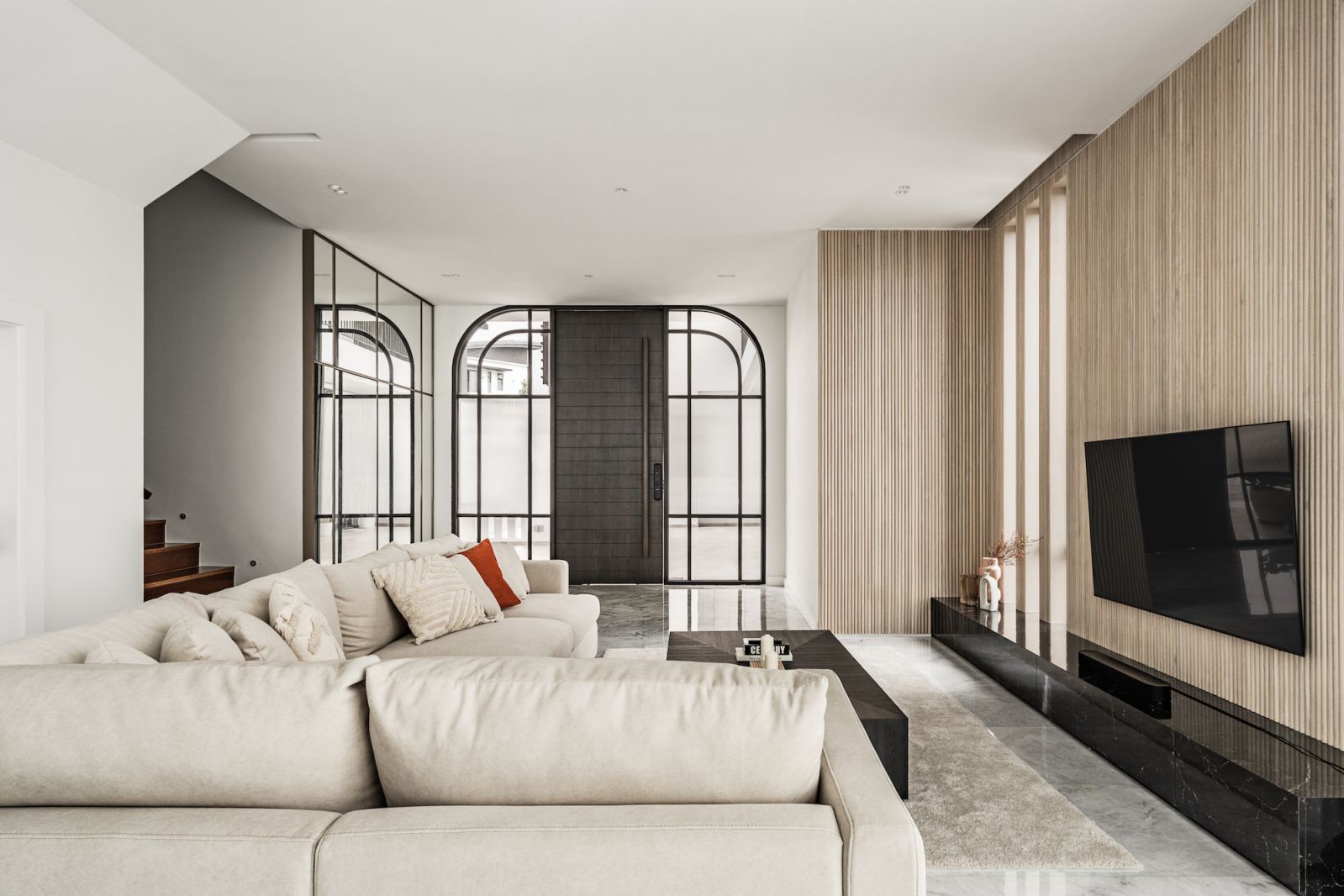 The living room done up in a style the designer coined as serene eclectic