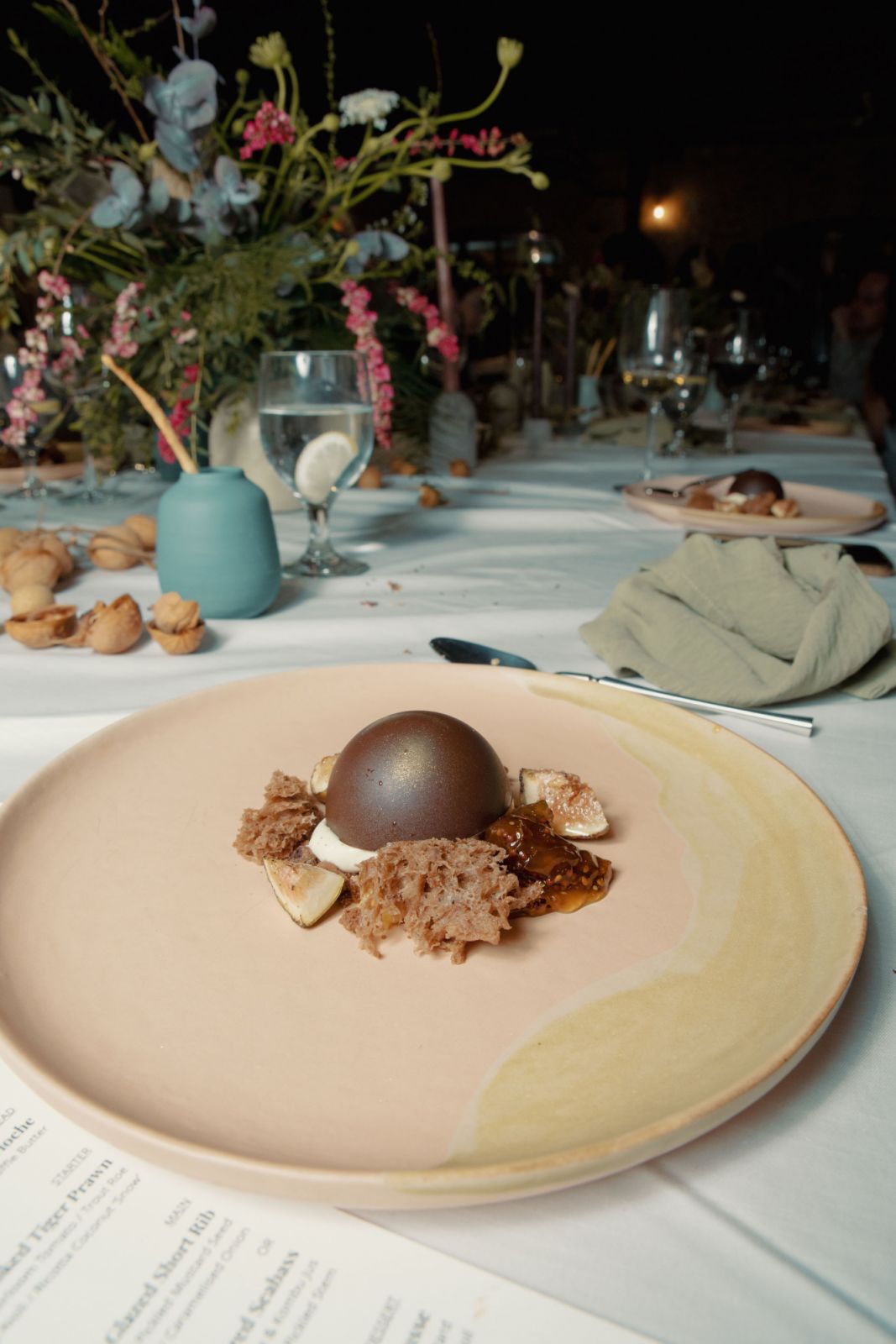 Dessert: The brown butter mousse consists of chocolate braised pear, hazelnut sponge, a drizzle of gooseberry mustard, and a sprinkle of mostarda and chocolate soil