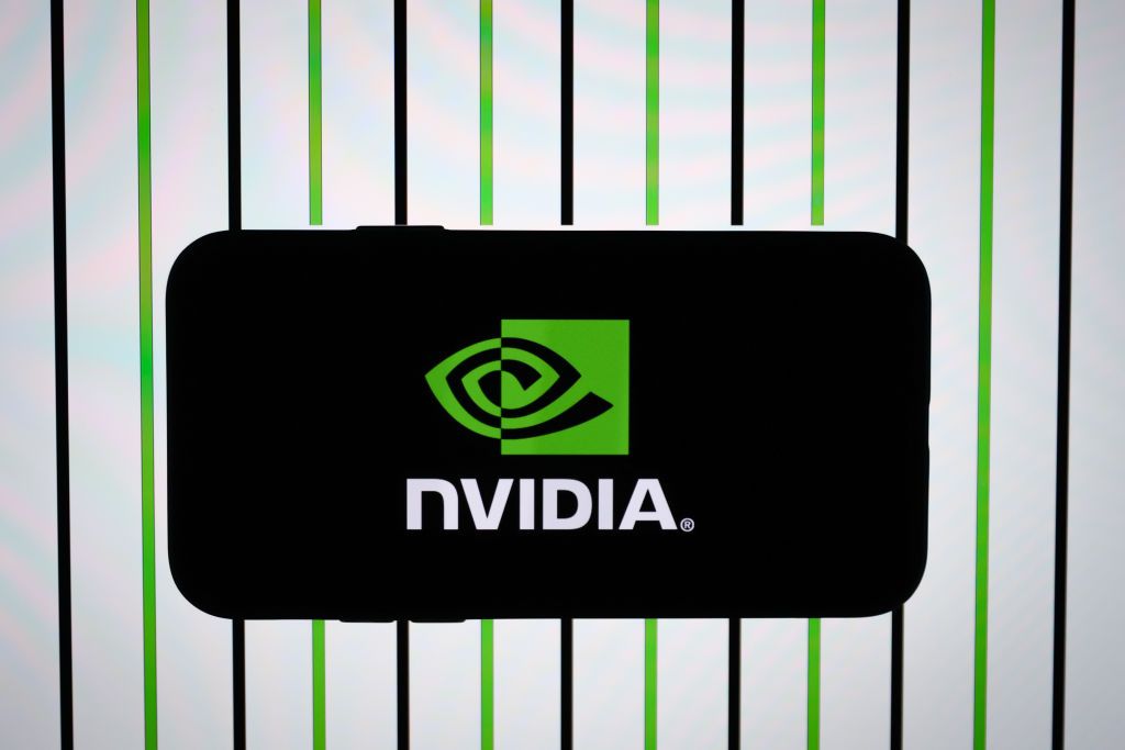 ANKARA, TURKIYE - NOVEMBER 23: In this photo illustration, Nvidia logo is displayed on a mobile phone screen in front of a computer screen in Ankara, Turkey on November 23, 2023. (Photo by Ahmet Serdar Eser/Anadolu via Getty Images)