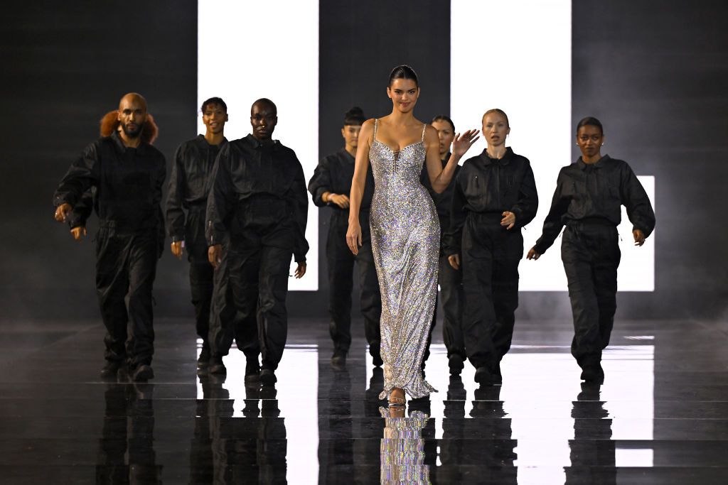 PARIS, FRANCE - OCTOBER 01: Kendall Jenner and performers walk the runway during "Le Défilé L'Oréal Paris - Walk Your Worth" Show as part of Paris Fashion Week at the Eiffel Tower on October 01, 2023 in Paris, France. (Photo by Kristy Sparow/Getty Images for L'Oreal Paris)
