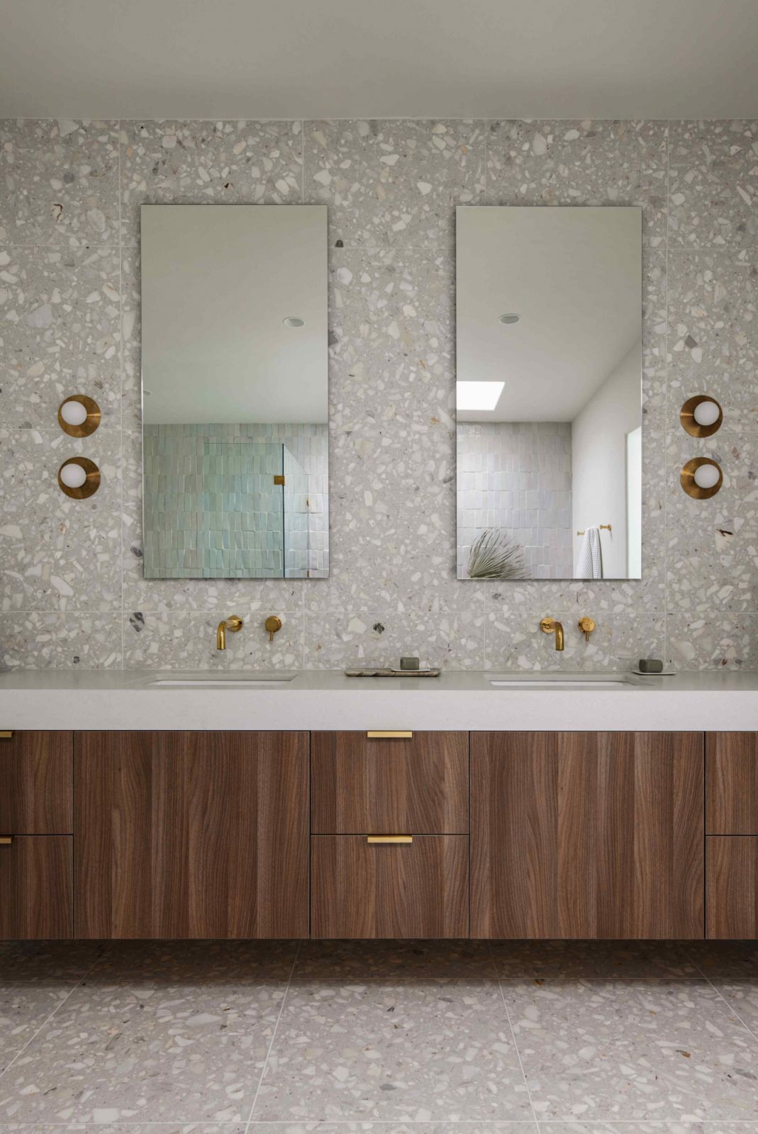 Soft terrazzo marble tiles in the primary bathroom ensuite