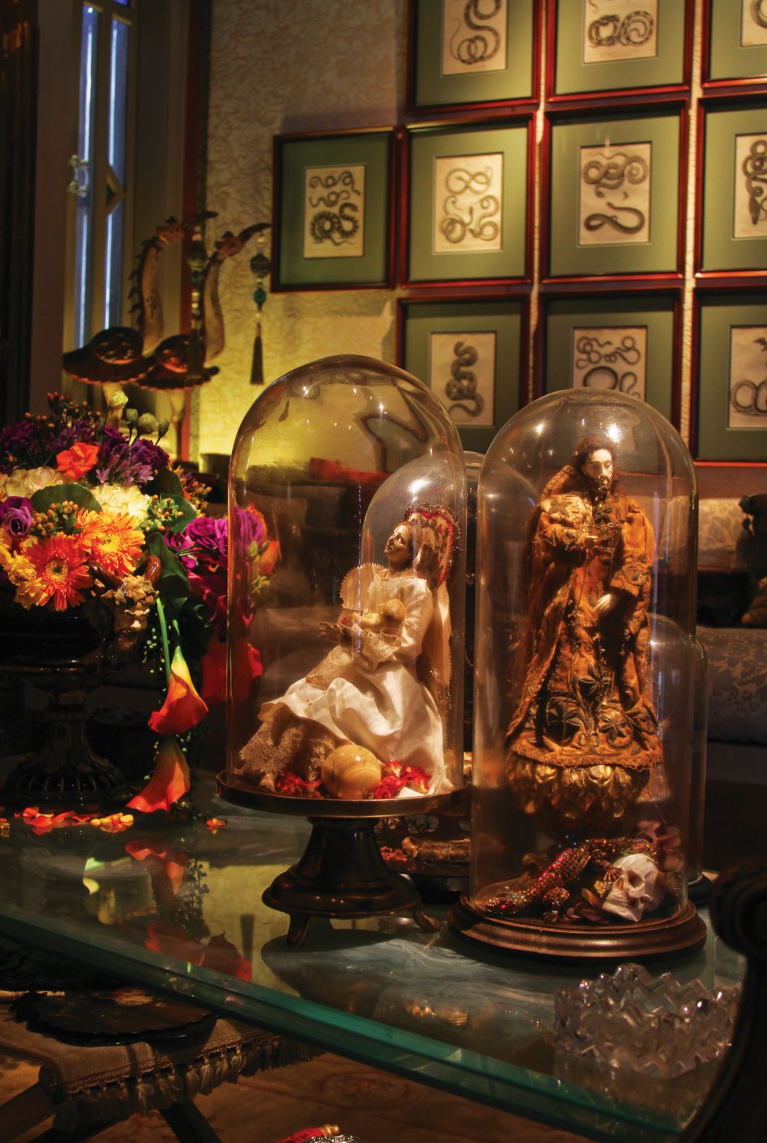 The serendipitous pairing of a Neapolitan statue of the Virgin Mary and a locally sourced ivory dormido against Albertus Seba snake prints from the 18th century