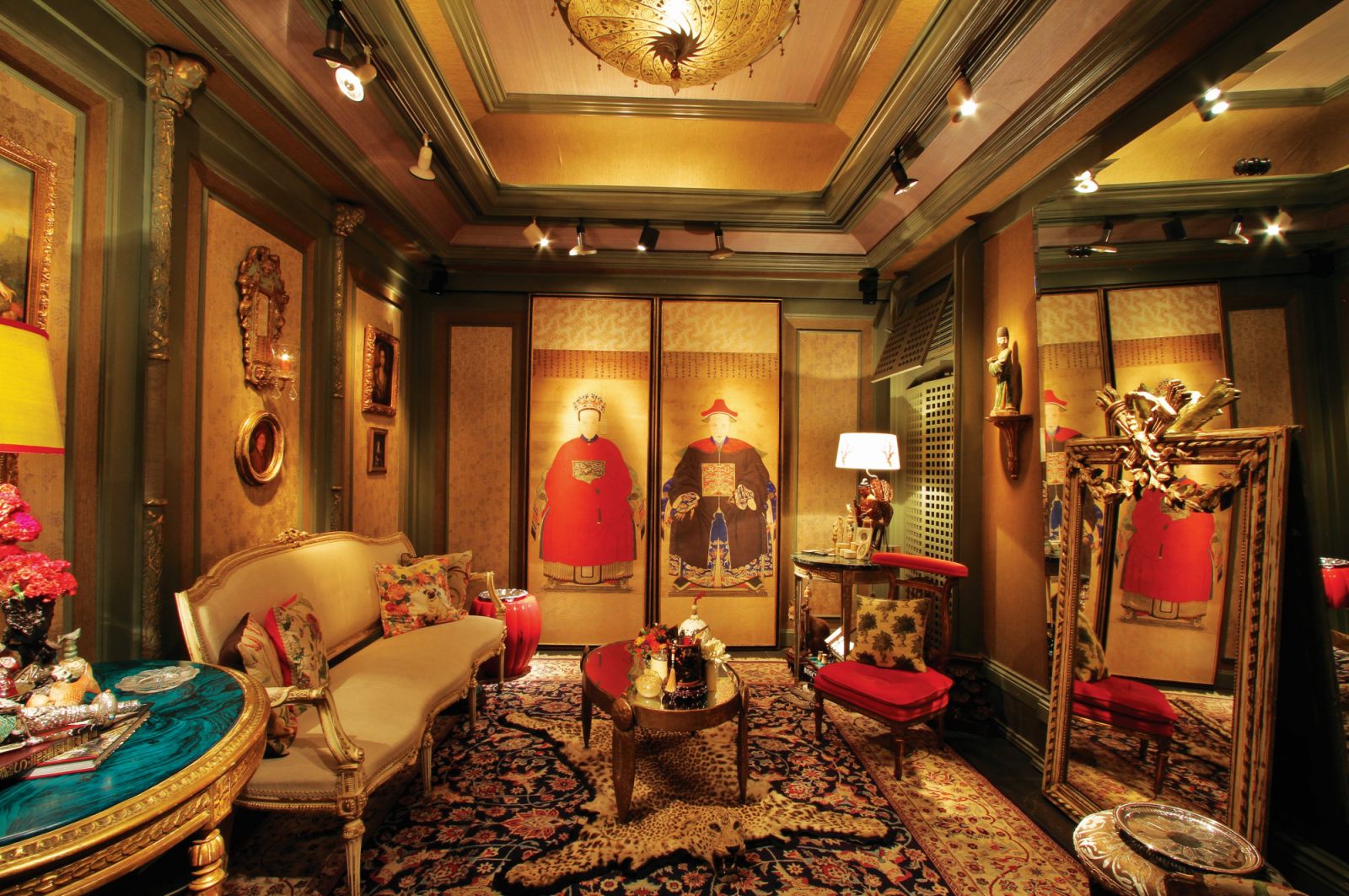 Chinese portrait doors are used to hide the entertainment system in the music room, which features furniture and authentic stuffed animals and skins from the Victorian period