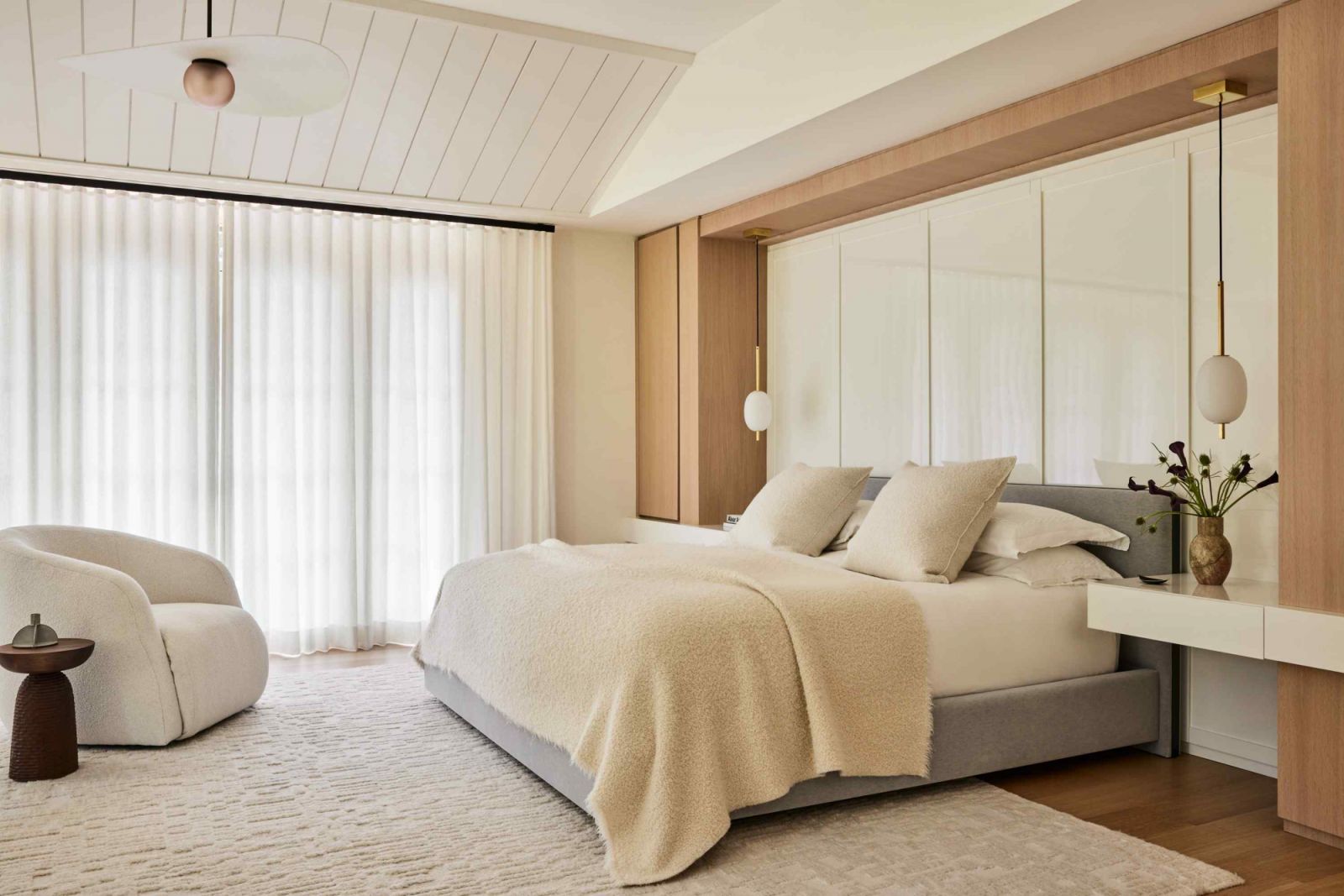 Boucle furnishings in the well-lit bedroom