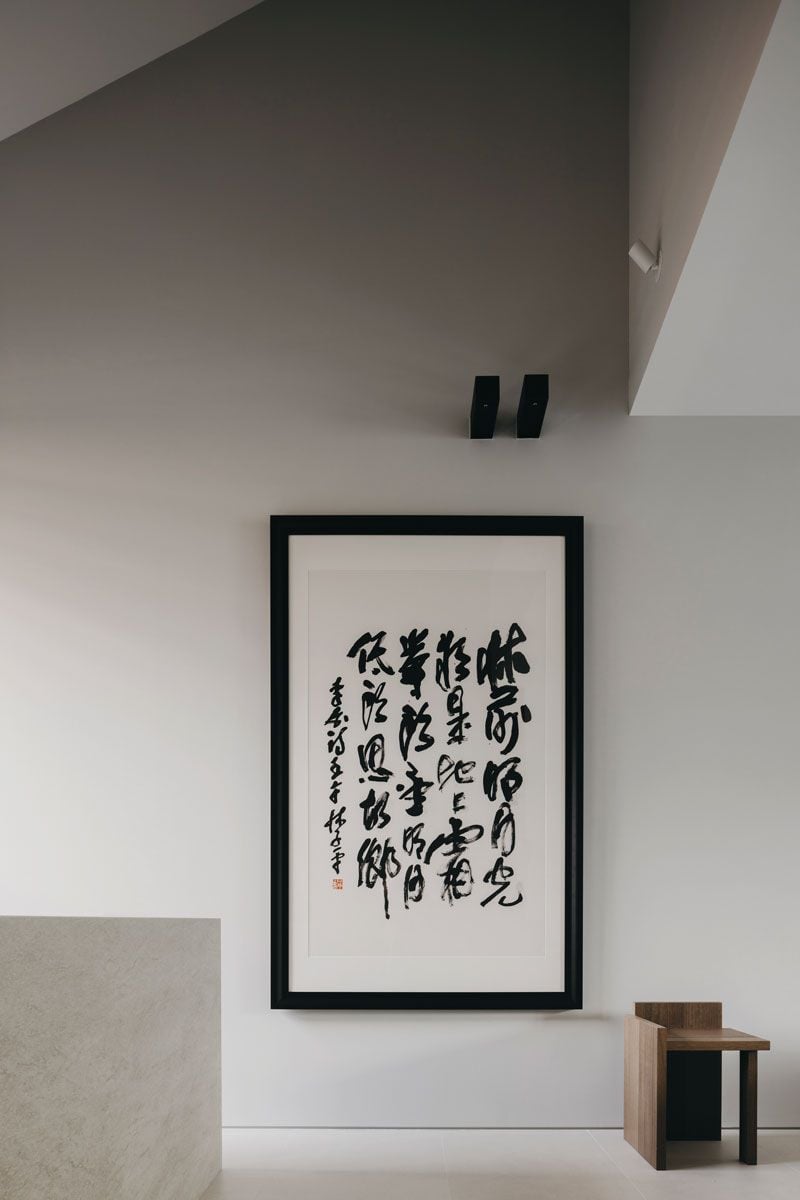 The Chinese calligraphy artwork brings a piece of heritage to the interior