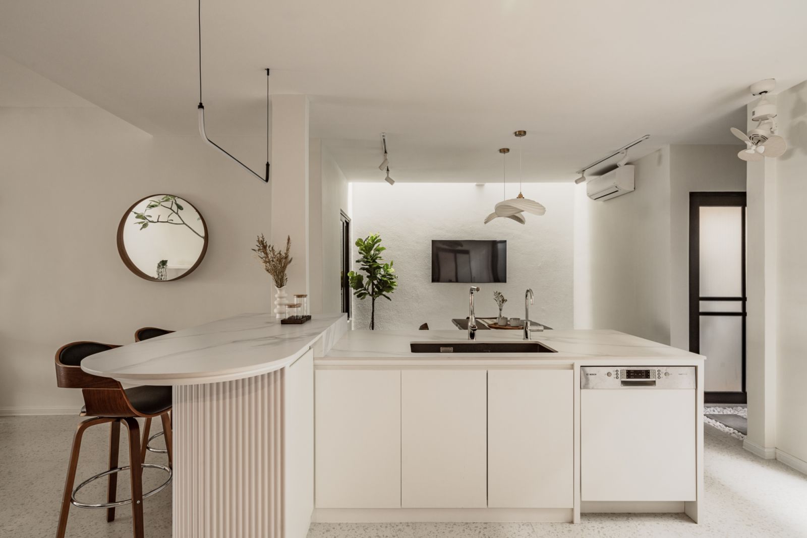 The pristine all-white kitchen