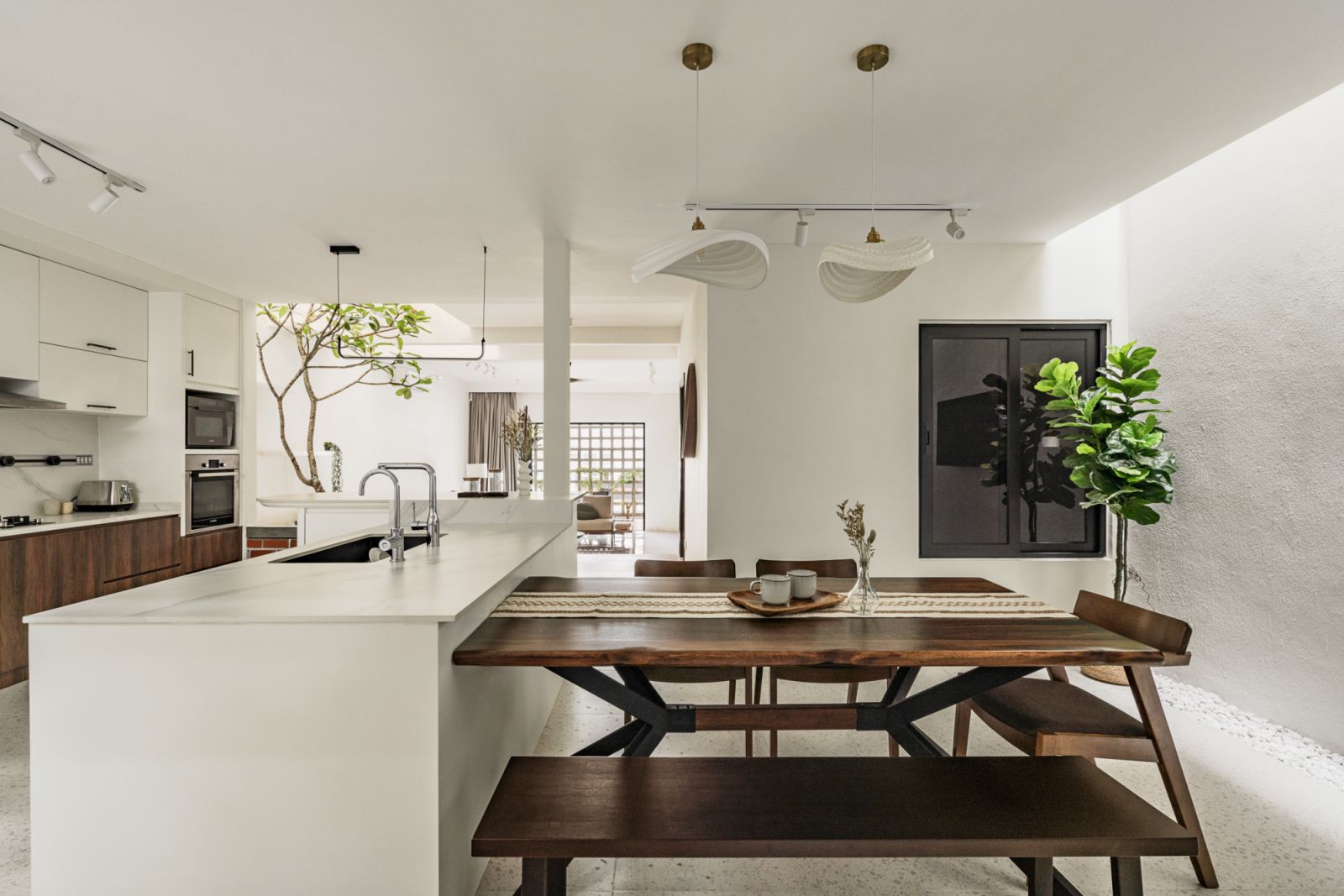 The bench and table are an extension of the island