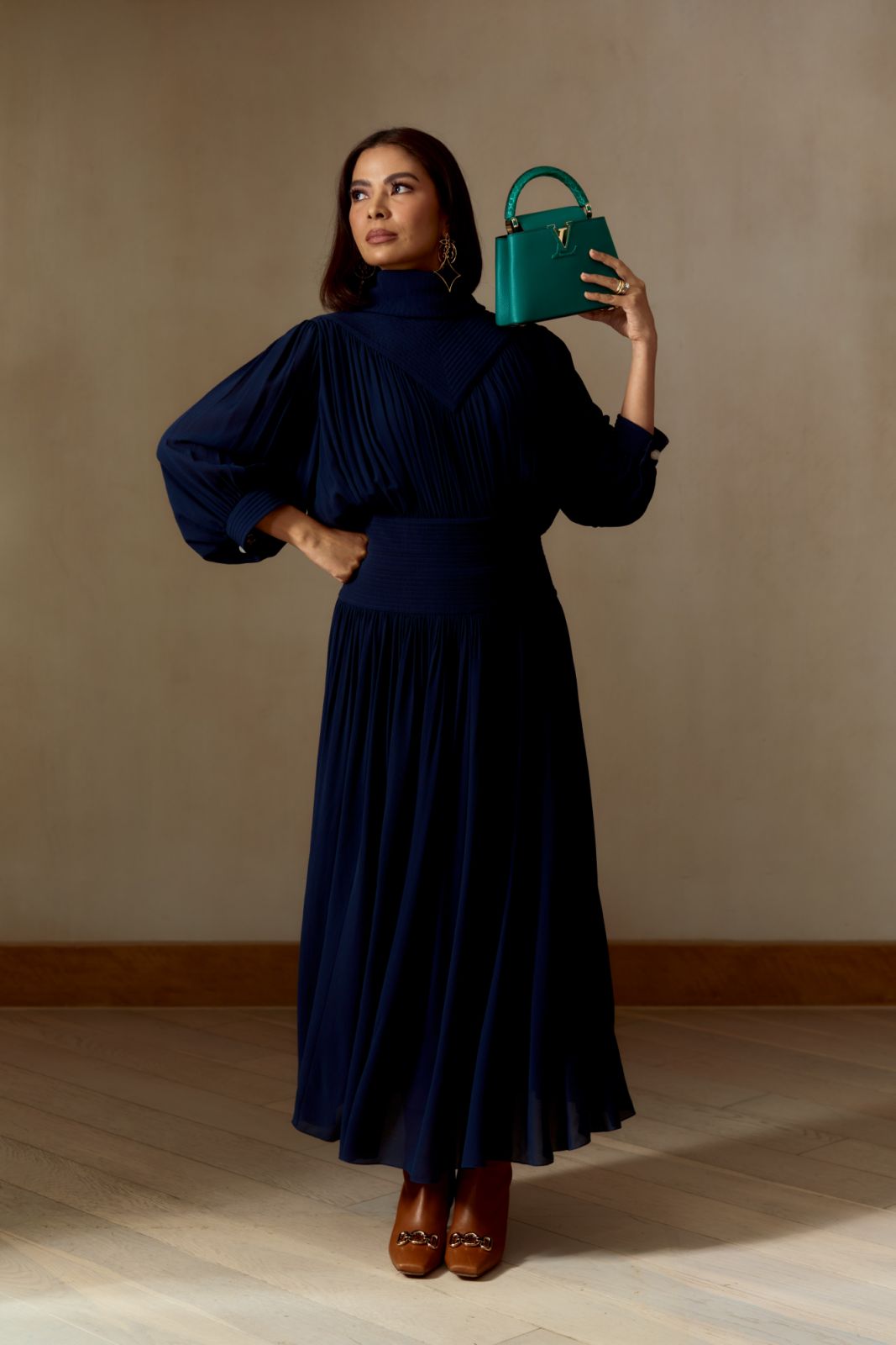 Rissa Mananquil Trillo with Capucines Mini handbag in emerald green taurillon leather. Louis Vuitton dress, LV Twiggy earrings (Photo: Artu Nepomuceno)