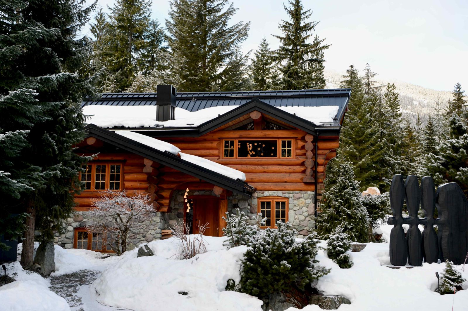 The winter pied-à-terre is nestled in the serene town of Whistler, bordered by an expansive forest
