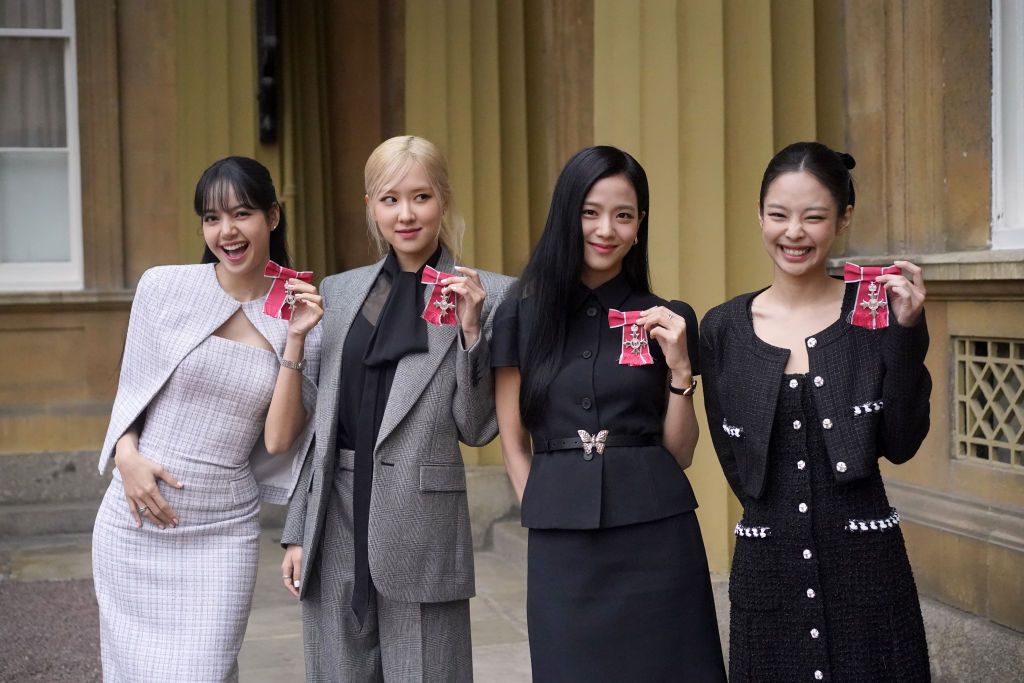 LONDON, ENGLAND - NOVEMBER 22: (left to right) Lisa (Lalisa Manoban), Rose (Roseanne Park), Jisoo Kim and Jennie Kim, from the K-Pop band Blackpink pose with their Honorary MBEs (Members of the Order of the British Empire), awarded to them in recognition of the band's role as COP26 advocates for the COP26 Summit in Glasgow 2021 on November 22, 2023 in London, England. King Charles III conducted the special Investiture ceremony in the presence of the President of South Korea, Yoon Suk Yeol, and his wife, Kim
