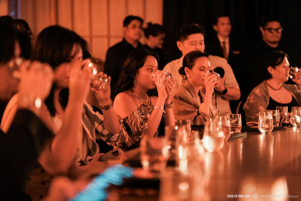 Guests take a sip of the limited edition Johnnie Walker Blue Label Elusive Umami