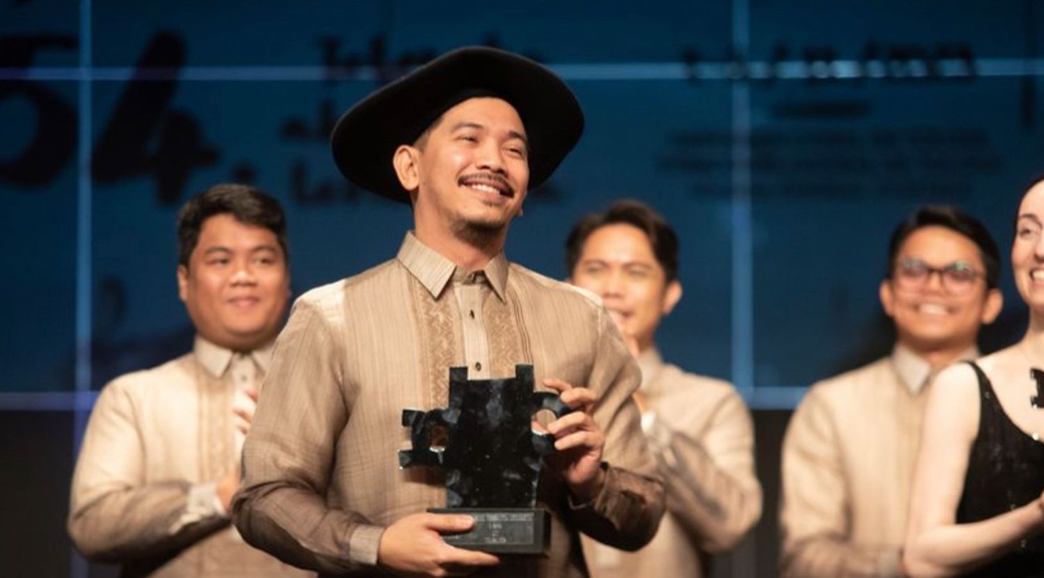 The Male Ensemble Philippines receiving the award