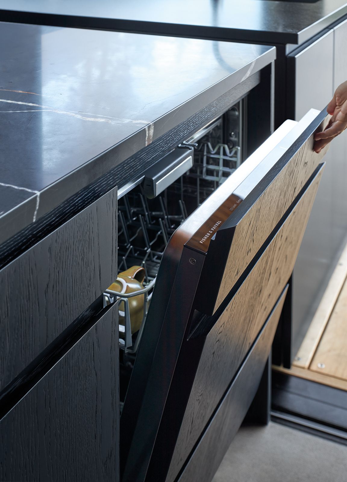 Refined finishes ensure a sleek kitchen for the owners