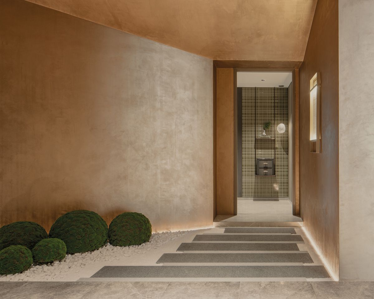 A tranquil pebbled path leads to the show unit