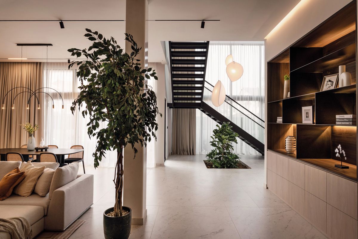 A view of the staircase from the open-plan living and dining room