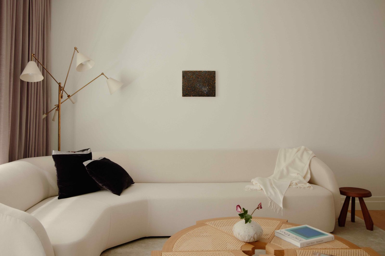 The cashmere sofa was built, assembled and upholstered on site to fit the corner of the living room perfectly