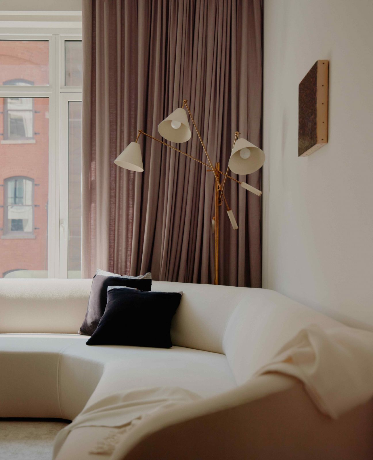 The living space benefits from abundant natural light coming in through a large window