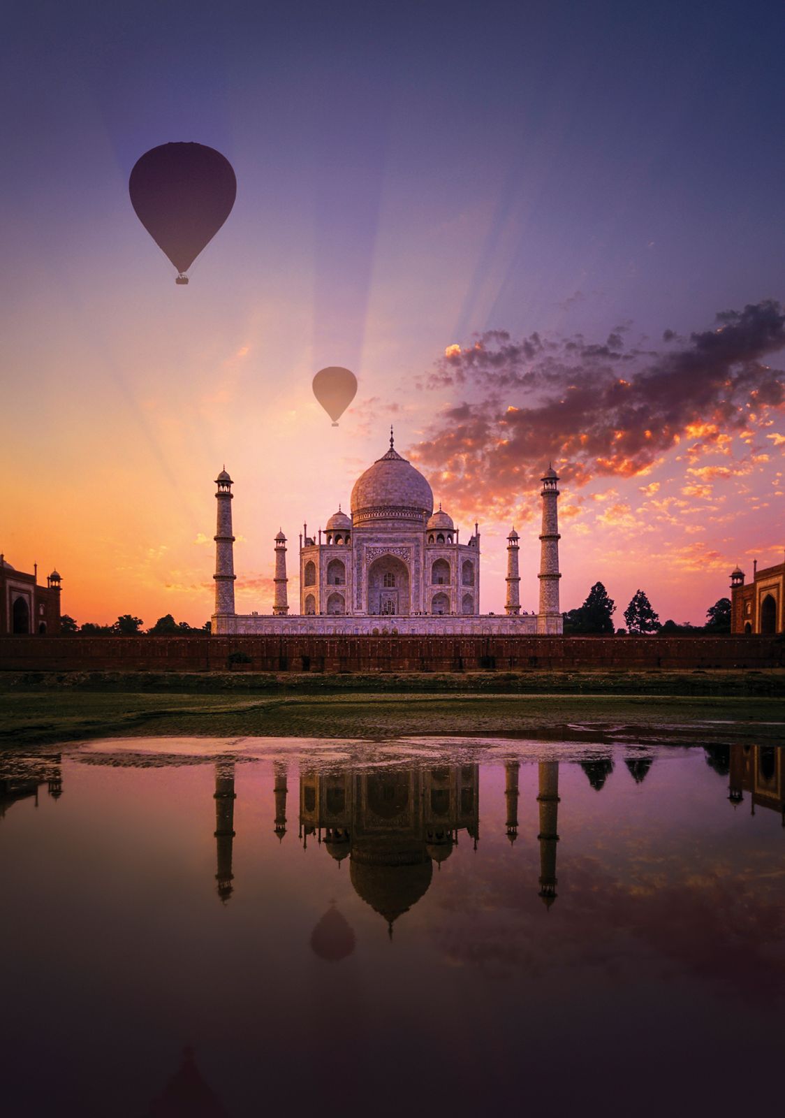 Hot air balloons soaring over the Taj Mahal in Agra city.