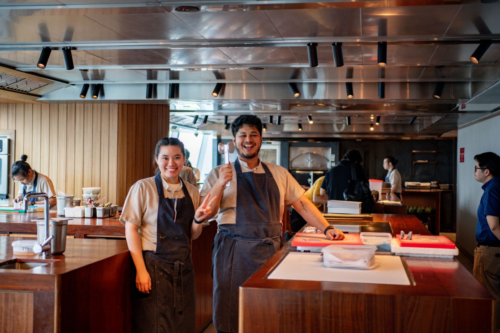 Members of Dewakan's team sharing a light moment before they get down to preparing the evening's dinner (Photo: Fady Younis)