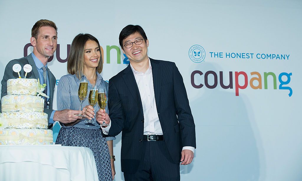 SEOUL, SOUTH KOREA - MAY 28: (L-R) Christopher Gavigan, CPO of The Honest Company, Jessica Alba and Bom Kim, CEO of Coupang toast during the press conference for E-commerce company "COUPANG" at the Grand Intercontinental Hotel on May 28, 2015 in Seoul, South Korea. South Korea based E-commerce service Coupang has been clinched an exclusive deal with a U.S. consumer goods maker co-founded by American actress Jessica Alba to sell their products in the local market. (Photo by Han Myung-Gu/WireImage)
