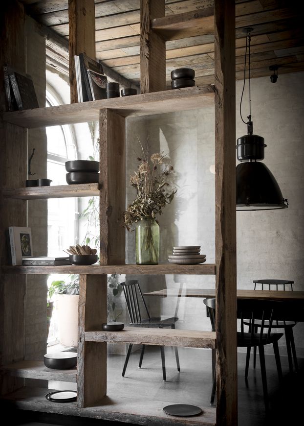Weathered Euro-pallets and vintage industrial pendant lamps (Photo: Norm Architects)