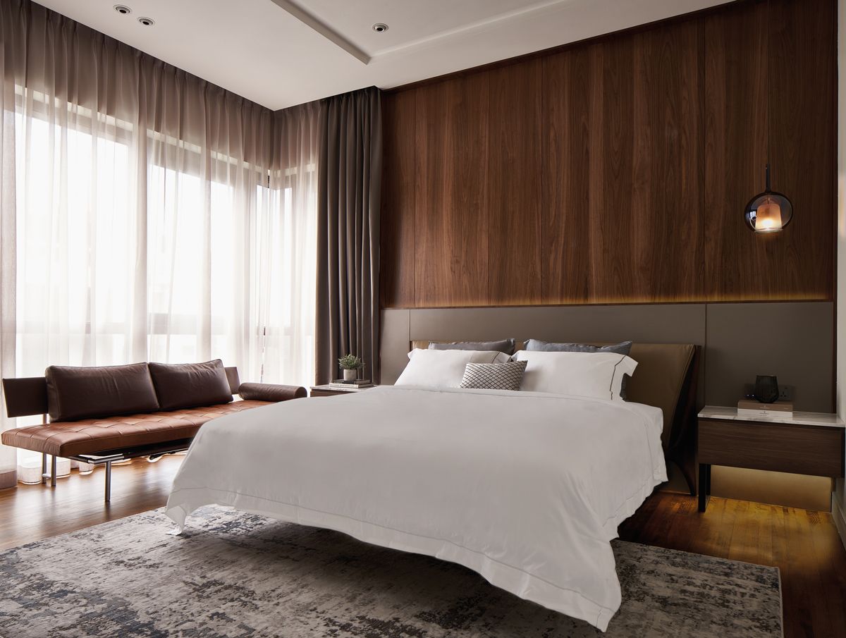 A textured rug contributes to the cosy ambience in the master bedroom