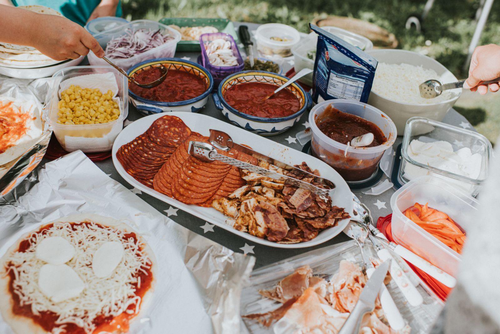A DIY pizza station complete with every fixing. (Photo: Catherine Falls Commercial / Getty Images)