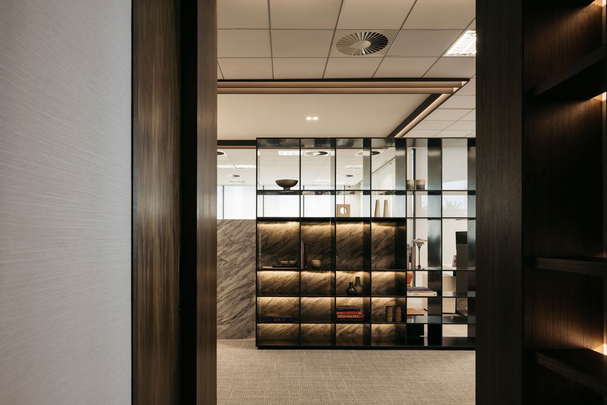The backlit display shelves make for an elegant space partition