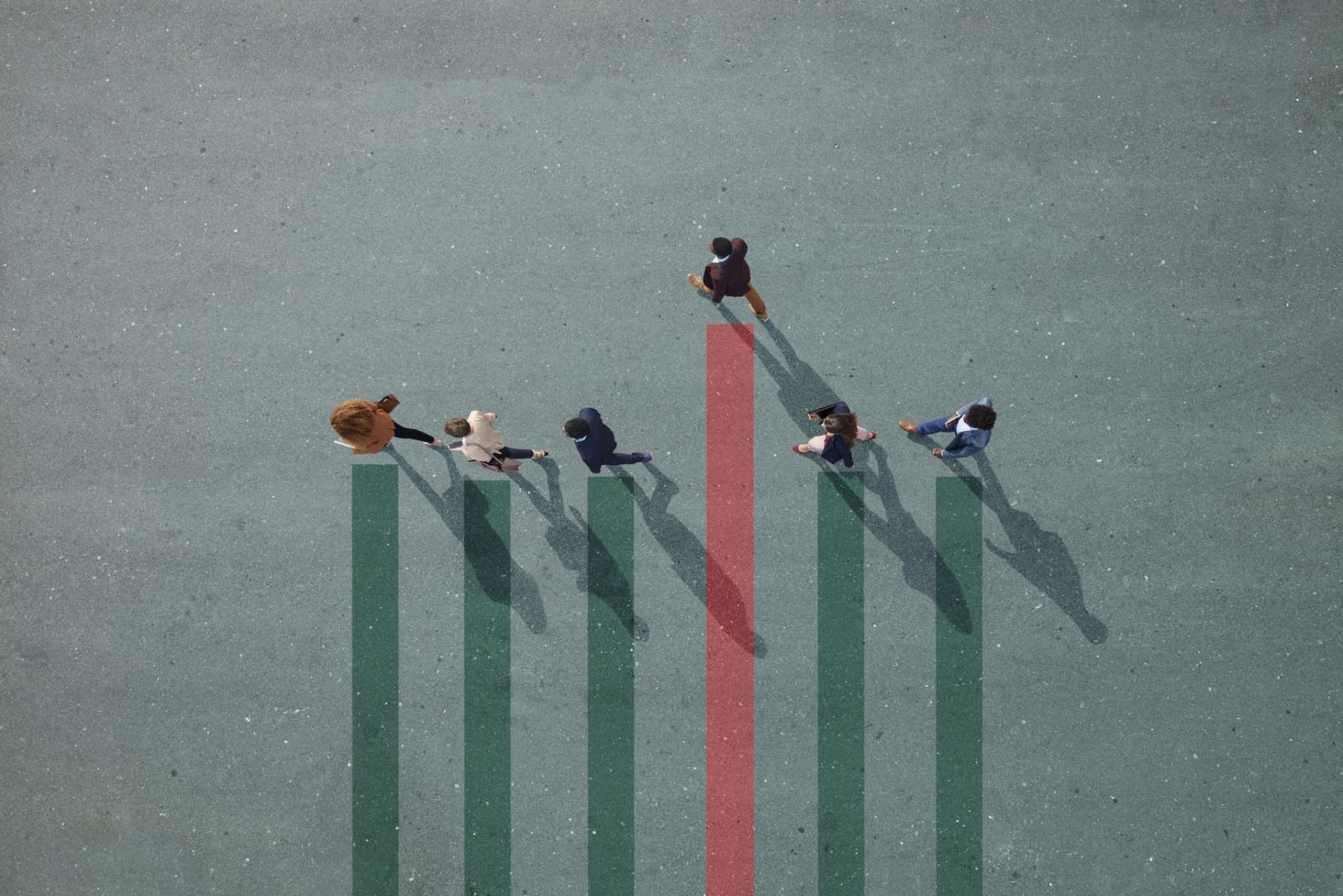 Group of young adults, photographed from above, on various painted tarmac surface, at sunrise.