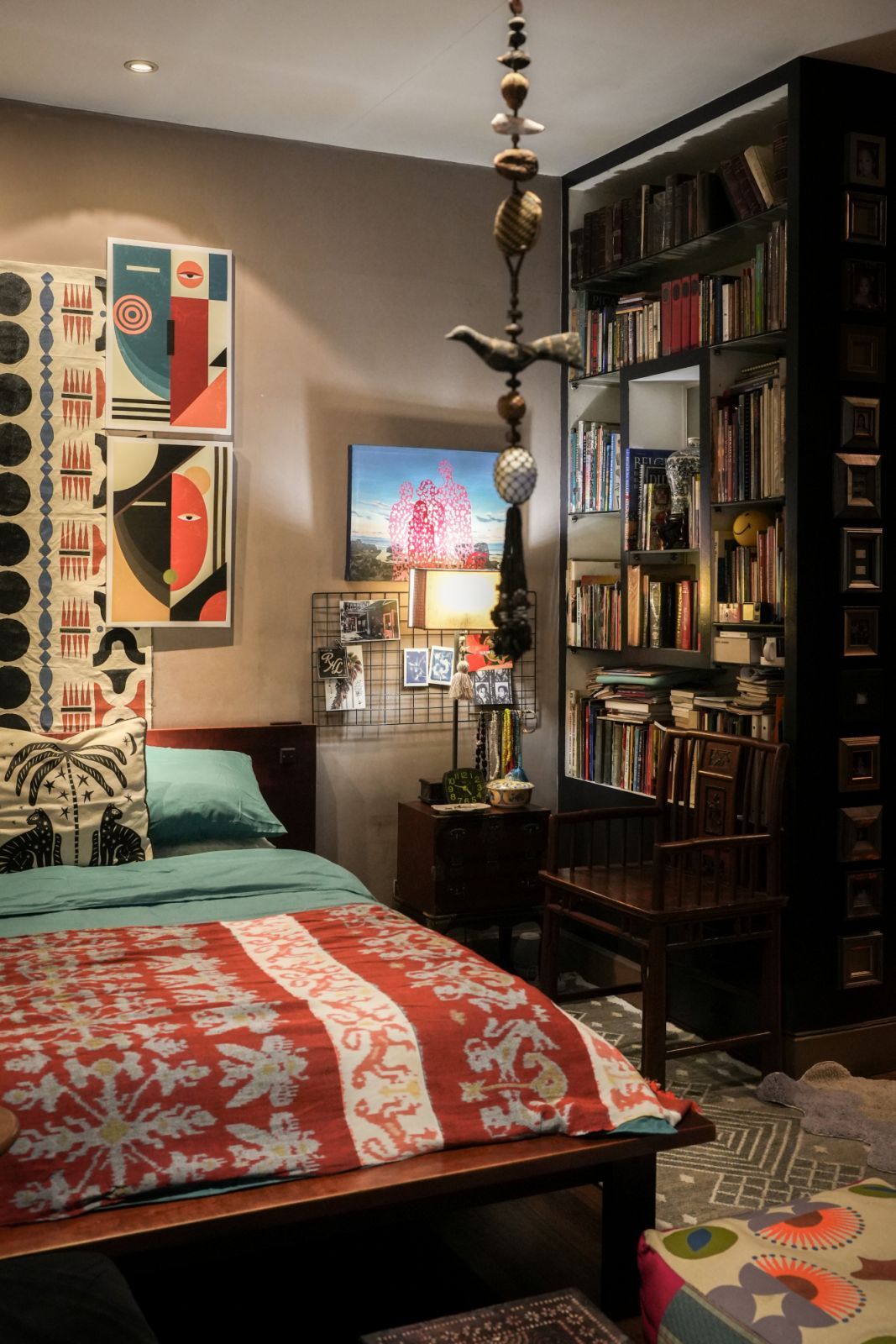 Hanging above the master bed is a tapestry by @travelfundbysiriusdan and African-inspired prints Bunag found at a market in Dubai. A handwoven shawl from Japan serves as bedcover and visual eye candy for the room (Photo: Kitty Bunag)