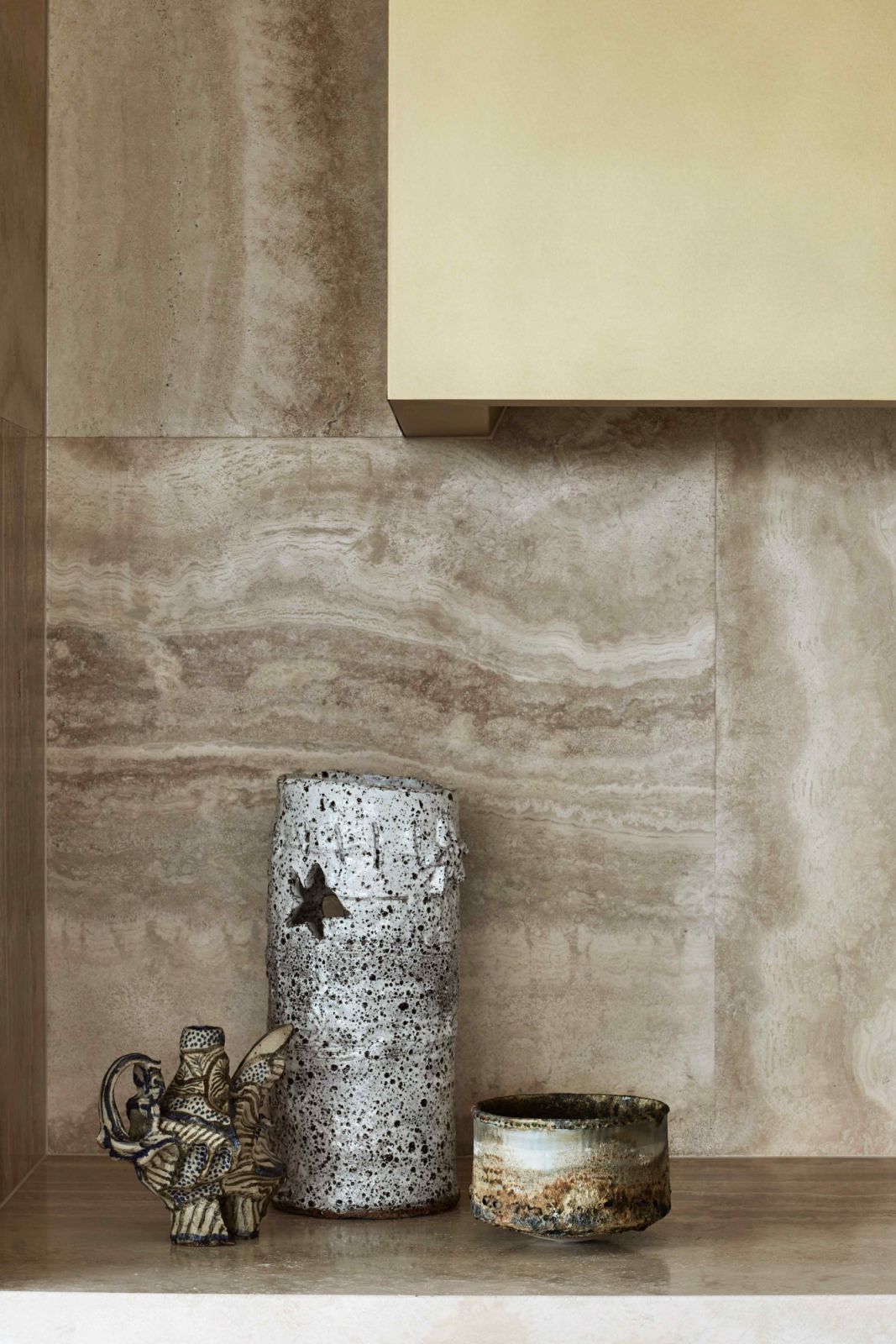 Veined marble and patterned travertine