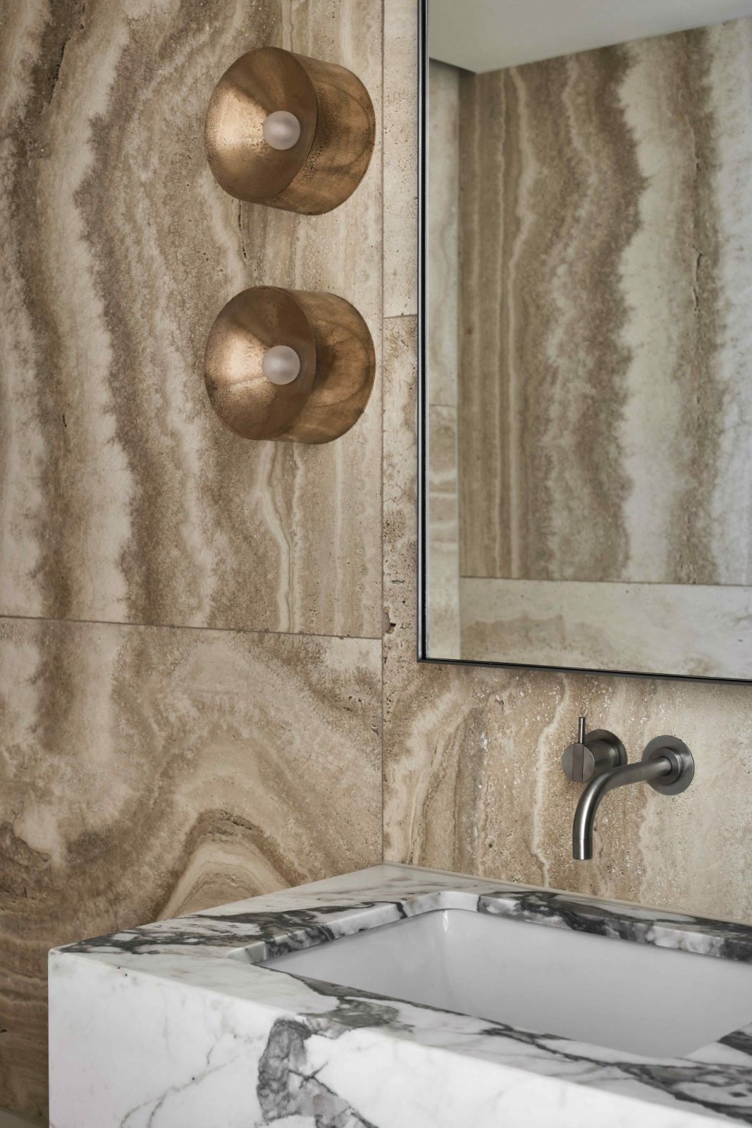 Earthy neutrals with a single-block Vagli marble basin