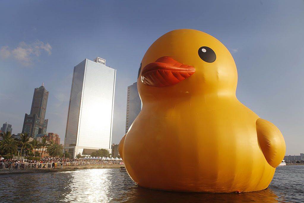 KAOHSIUNG, TAIWAN - SEPTEMBER 19: A giant Rubber Duck by Dutch conceptual artist Florentijin Hofman arrives into Glory Pier on September 19, 2013 in Kaohsiung, Taiwan. The 'Rubber' Duck,' is traveling the world and will stop in Kaohsiung from September 19 to October 20. (Photo by Ashley Pon/Getty Images)
