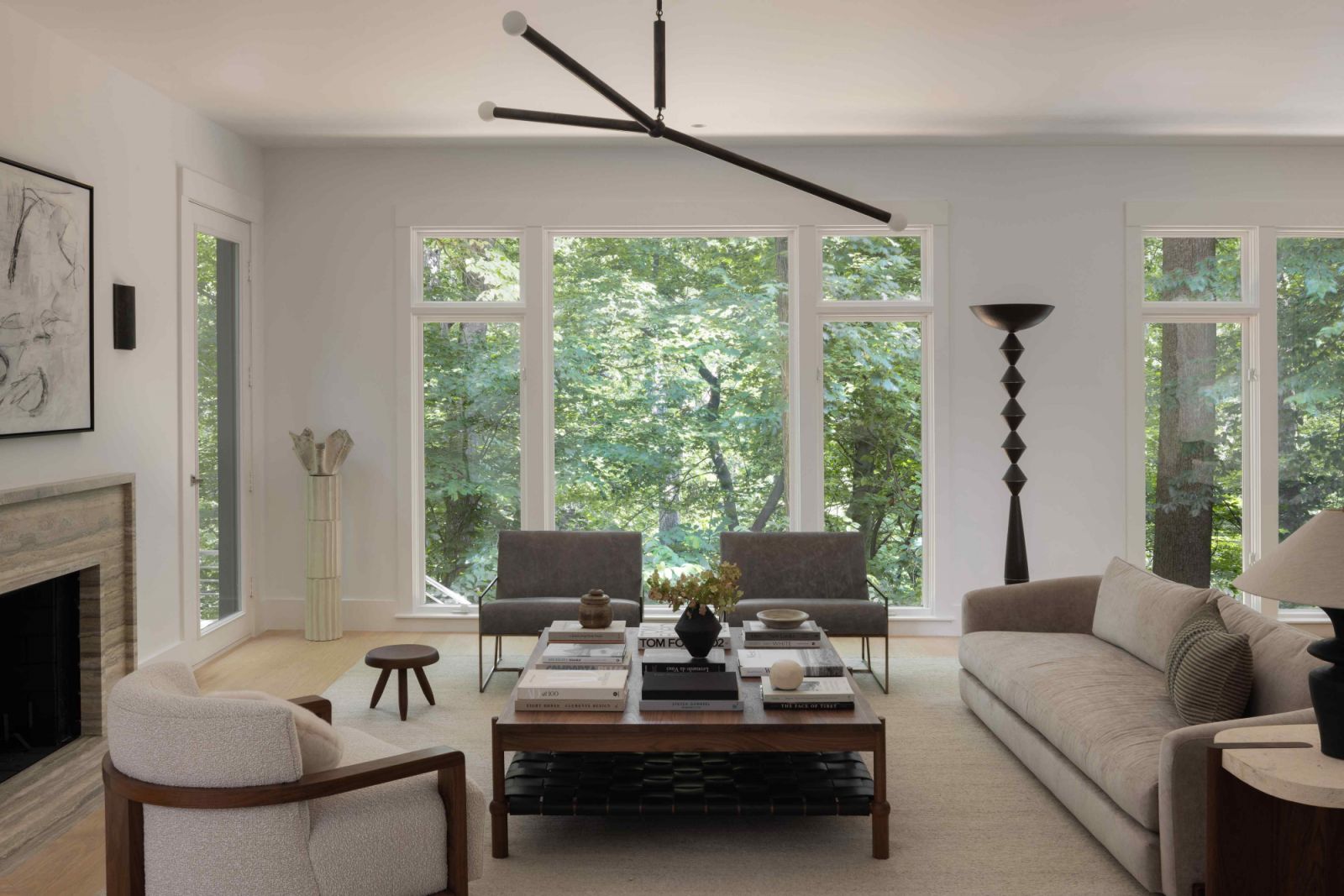 An unimpeded view of the verdant outdoors in the neutral-toned living room
