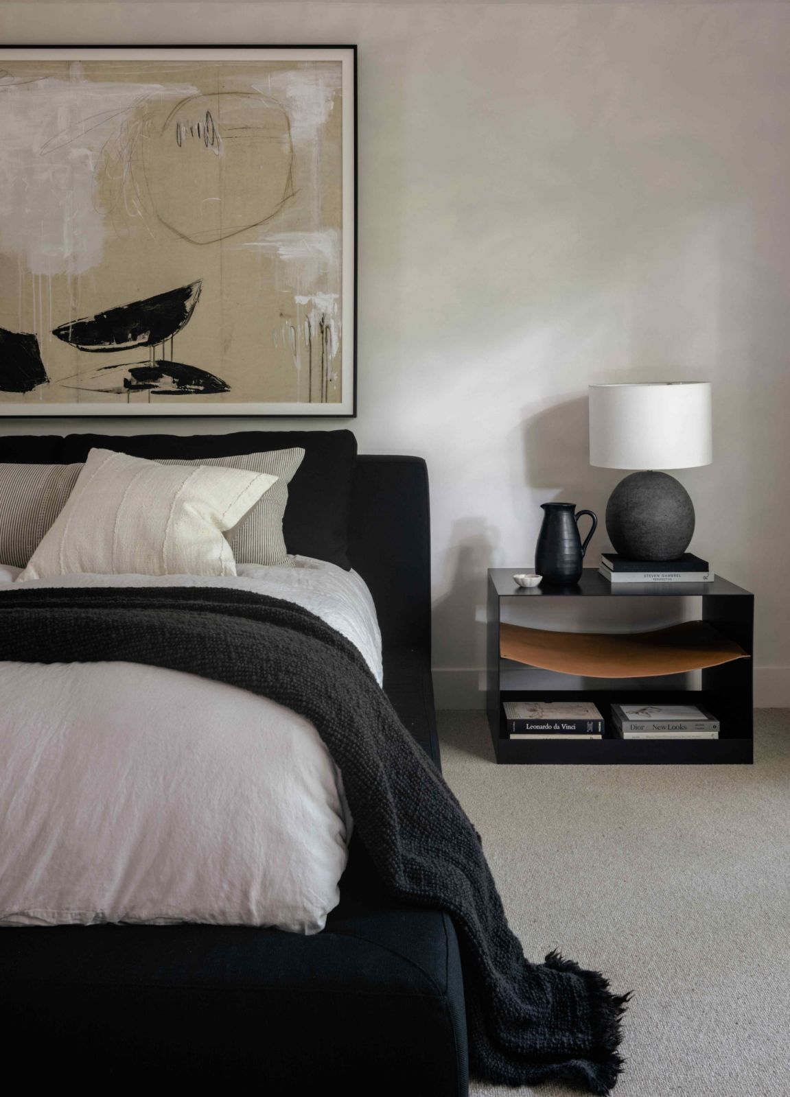 Dark upholstery bed frame in the primary suite