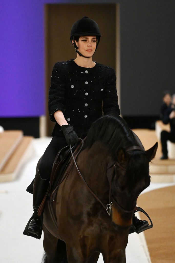 PARIS, FRANCE - JANUARY 25: (EDITORIAL USE ONLY - For Non-Editorial use please seek approval from Fashion House) Charlotte Casiraghi rides a horse on the runway during the Chanel Haute Couture Spring/Summer 2022 show as part of Paris Fashion Week at Le Grand Palais Ephemere on January 25, 2022 in Paris, France. (Photo by Pascal Le Segretain/Getty Images)