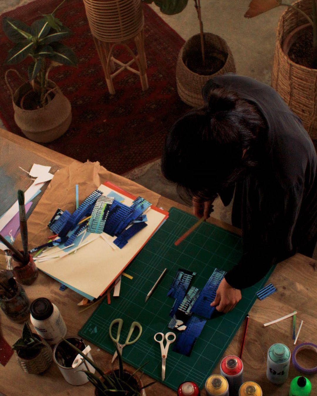 Artist Nini Sum designing A Night on Earth--The Journey's packaging