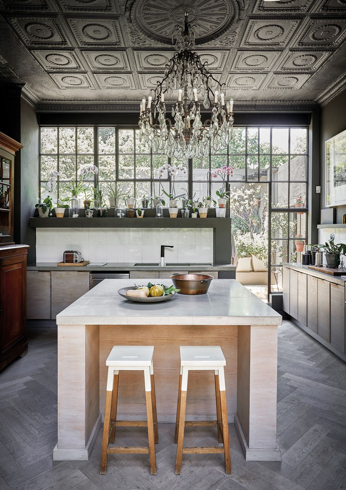 A converted cottage with intricate pressed-metal ceilings