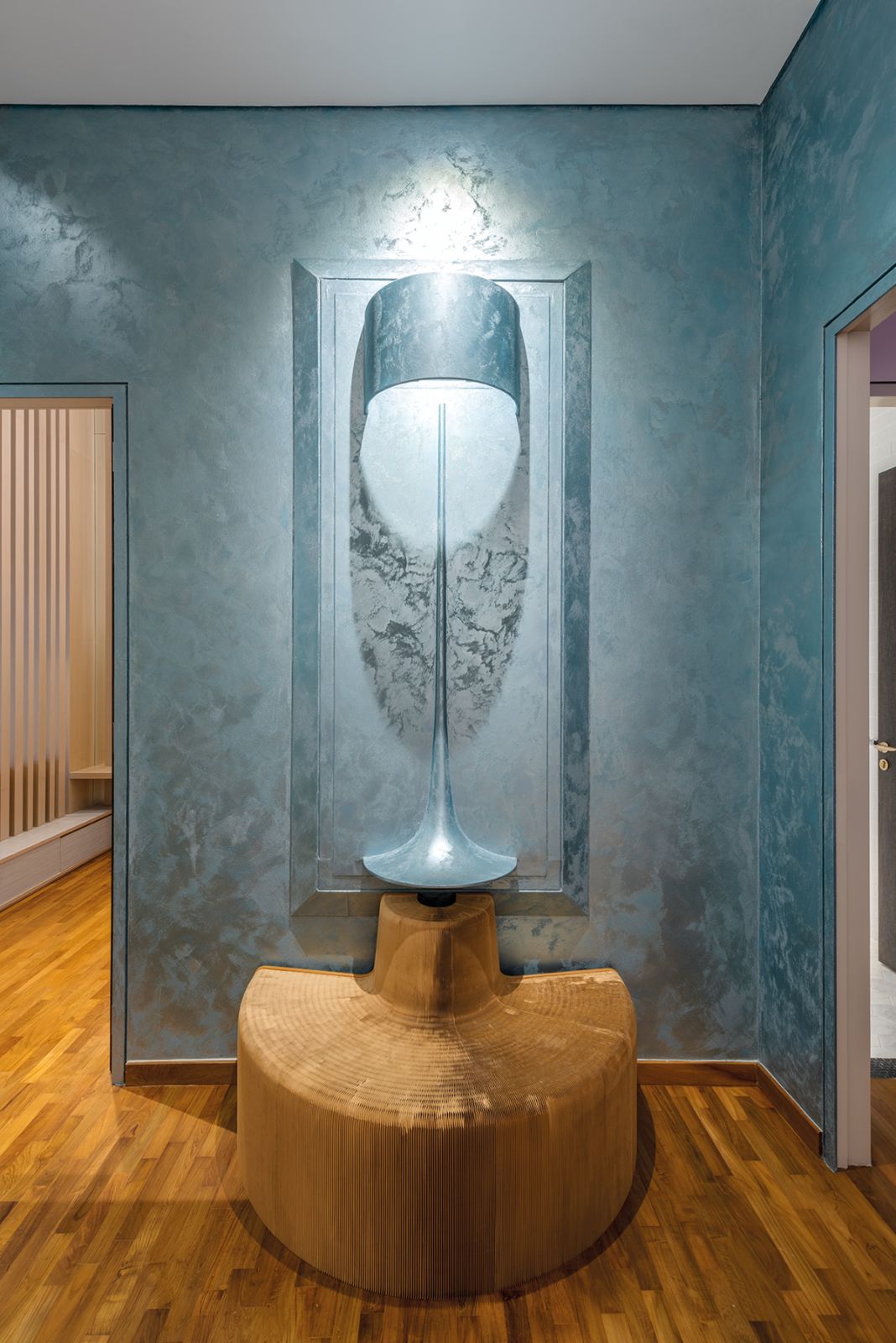 The use of blue elevates this cosy nook