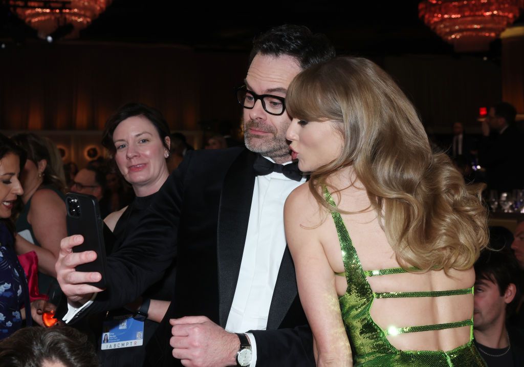 Bill Hader and Taylor Swift at the 81st Golden Globe Awards held at the Beverly Hilton Hotel on January 7, 2024 in Beverly Hills, California. (Photo by Rich Polk/Golden Globes 2024/Golden Globes 2024 via Getty Images)