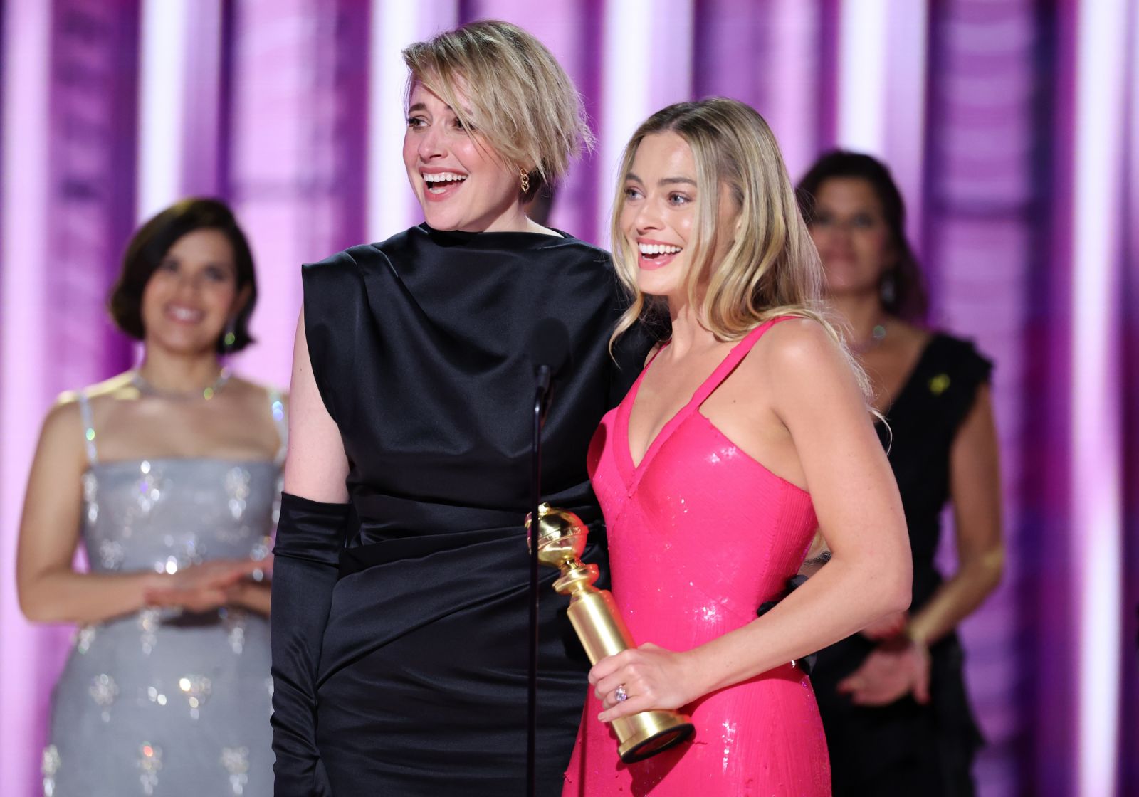 Greta Gerwig and Margot Robbie accept the award for Cinematic and Box Office Achievement for "Barbie" at the 81st Golden Globe Awards held at the Beverly Hilton Hotel on January 7, 2024 in Beverly Hills, California. (Photo by Rich Polk/Golden Globes 2024/Golden Globes 2024 via Getty Images)