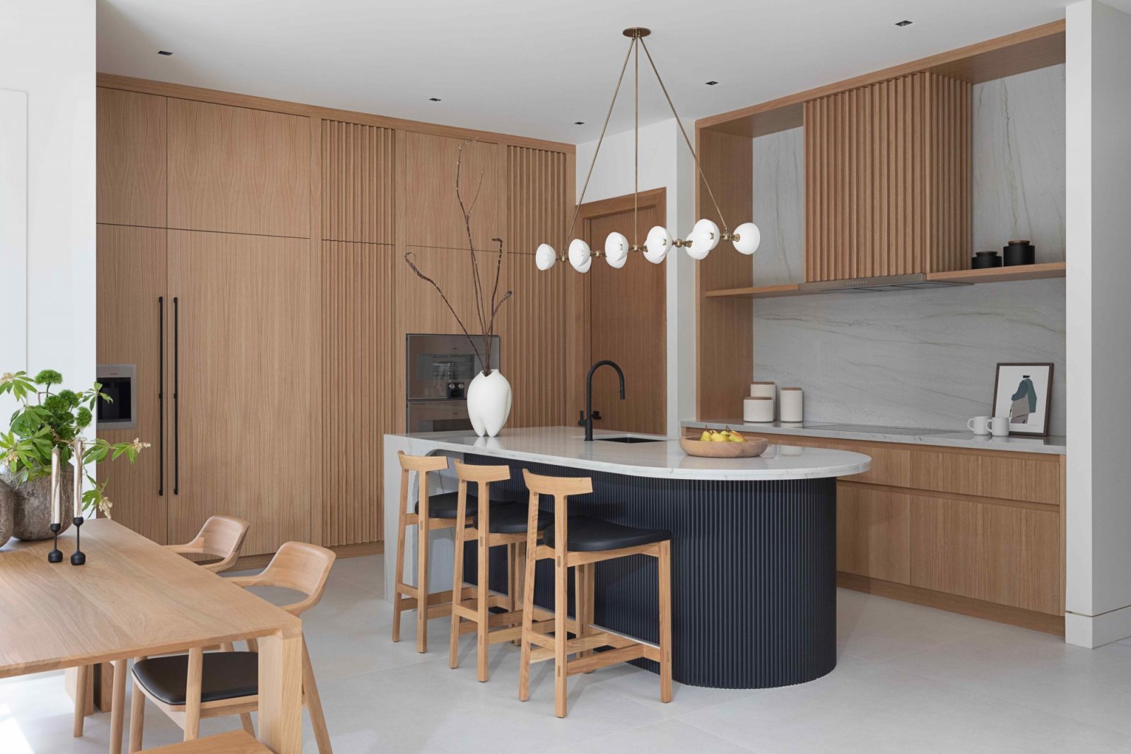 The open plan dining and kitchen area with ample storage