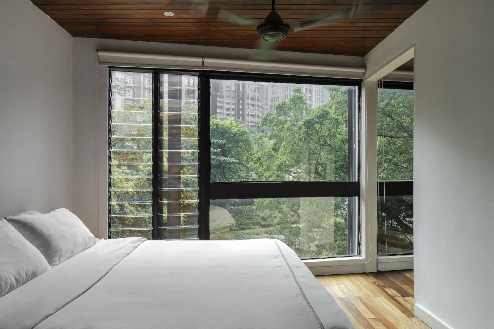The master bedroom overlooks a green expanse