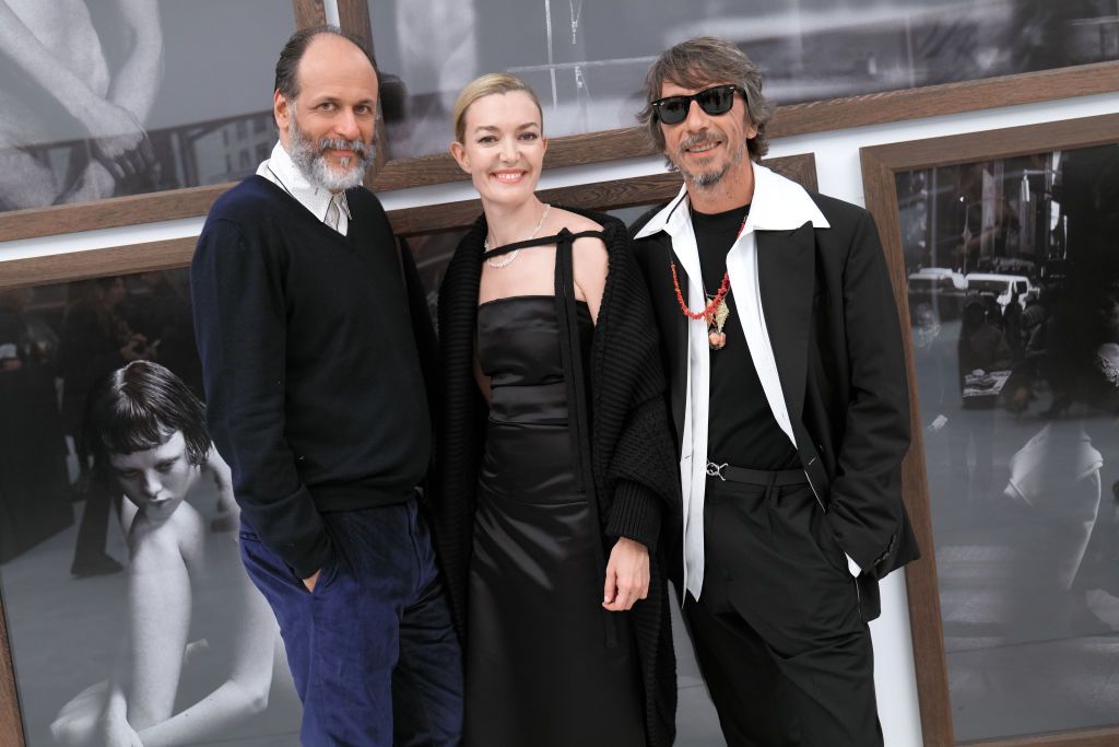 A CORUÃA, GALICIA, SPAIN - DECEMBER 01: (L-R) Screenwriter Luca Guadagnino; Inditex's new CEO Marta Ortega and fashion designer Pierpaolo Piccioli poseduring the social celebration prior to the public opening of photographer Peter Lindbergh's exhibition 'Untold Stories' at the Muelle de la Bateria on December 1, 2021, in A Coruña, Galicia, Spain. Marta Ortega Perez and Benjamin Lindbergh host an evening in which the international art and fashion world celebrated the arrival in A Coruña of the first majo