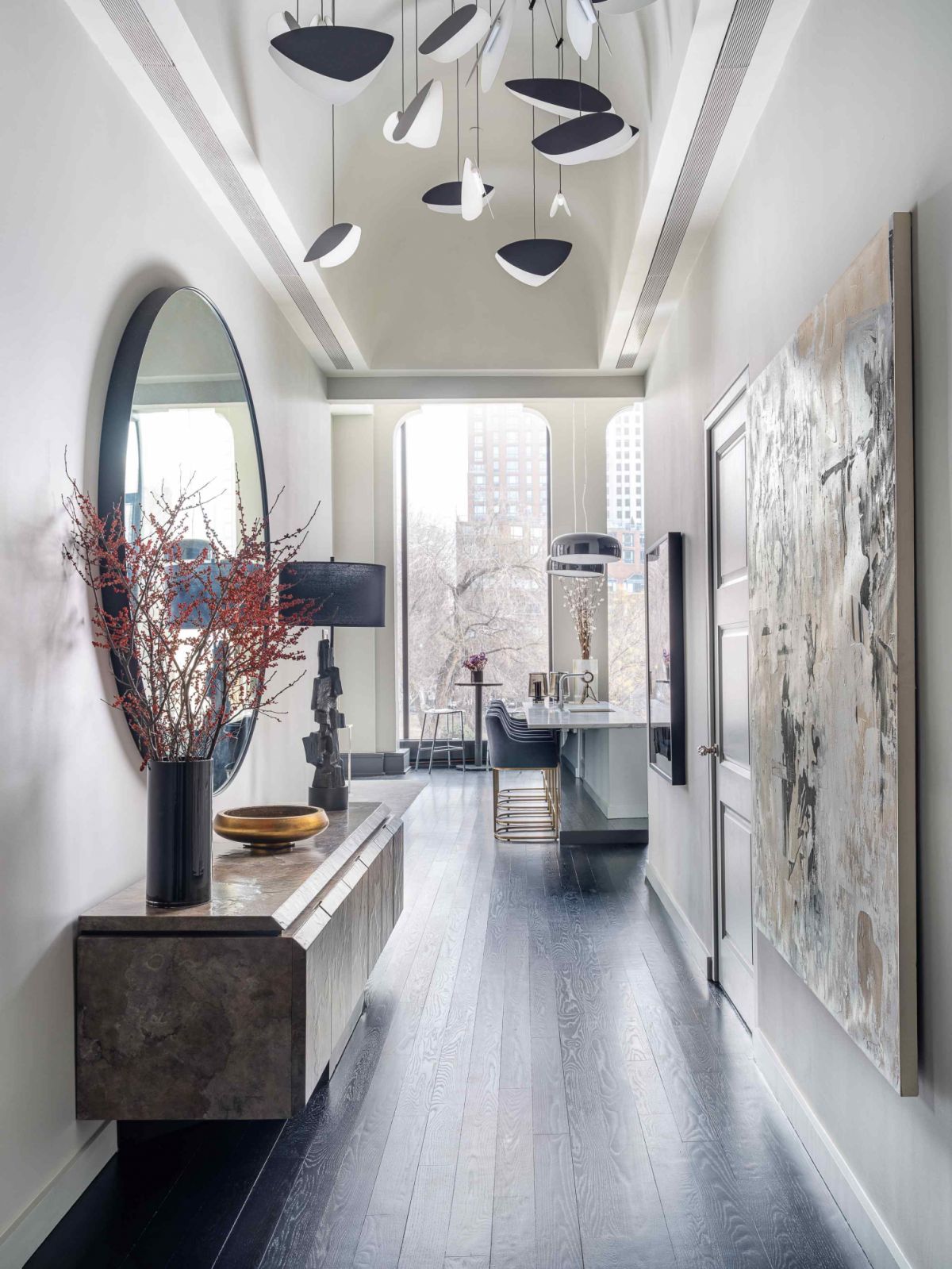 The pendant in the coved ceiling gallery hallway, reminiscent of the iconic 1960 Calder mobile by Alexander Calder