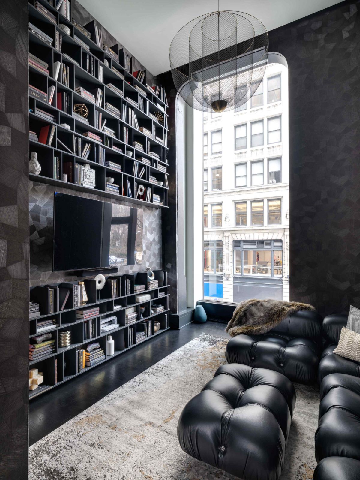 Floor-to-ceiling bookshelves elevated the home office