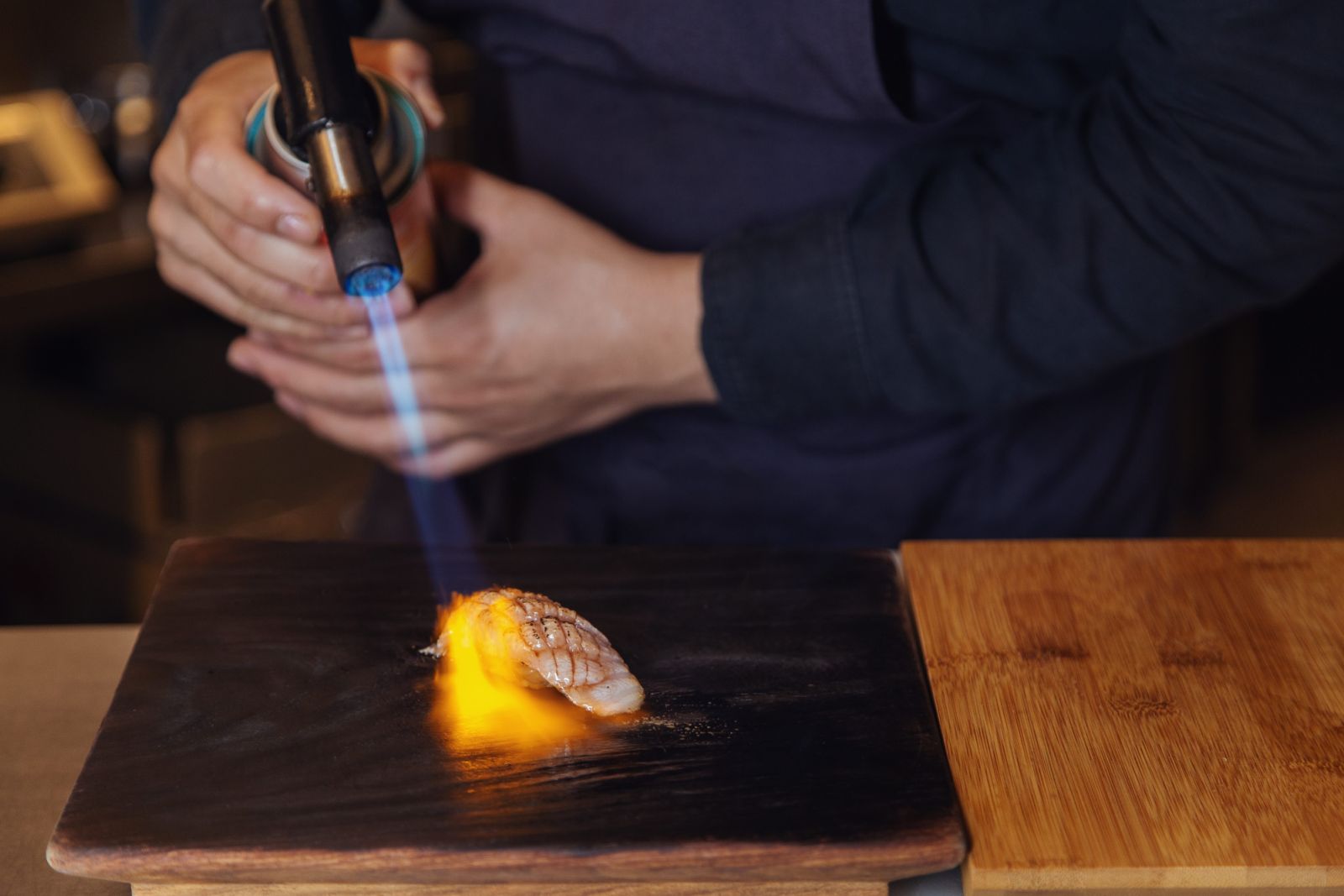 Torching the fish gives it an extra dimension in texture and flavour