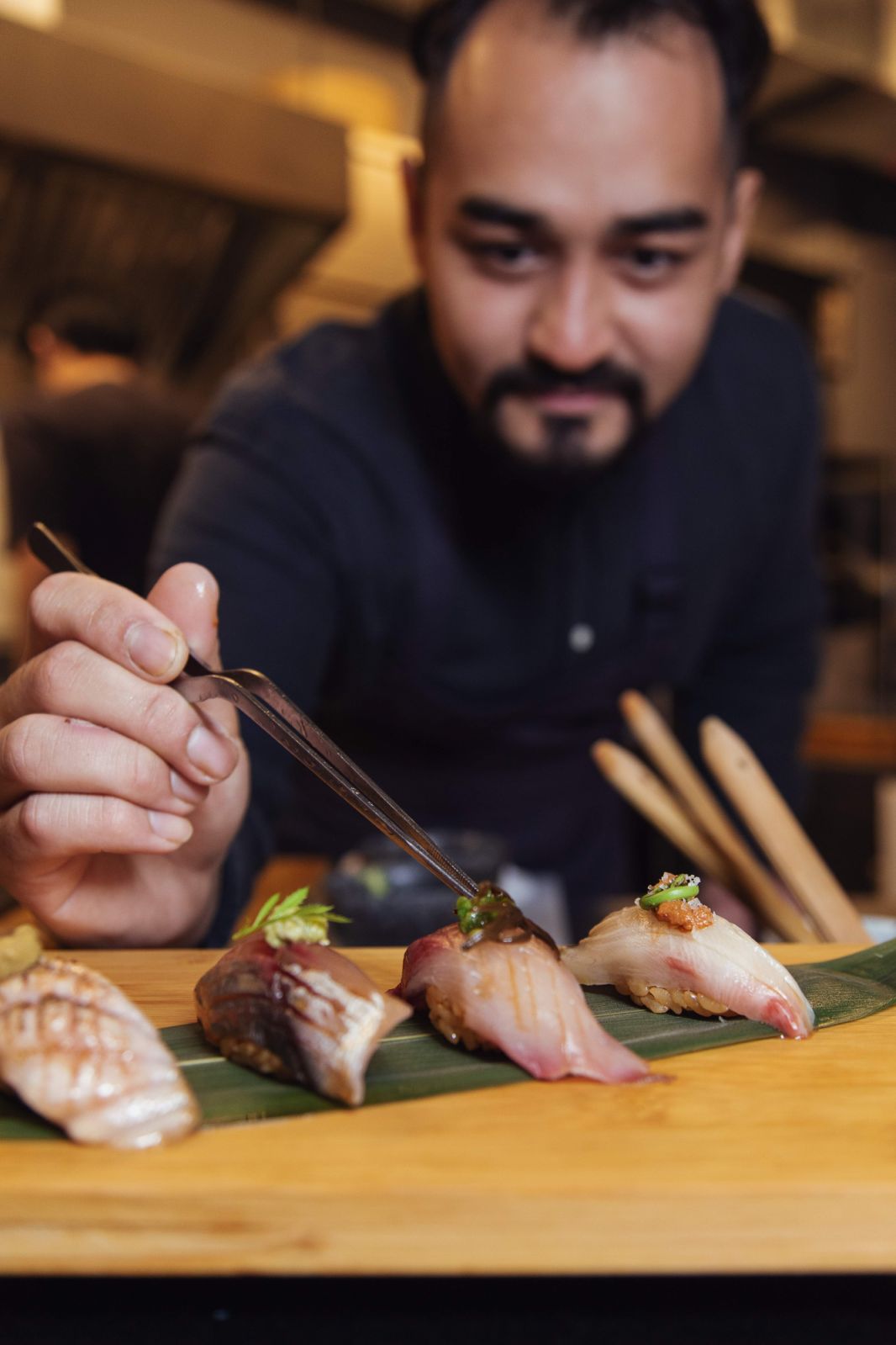 Yee serving up his signature nigiri