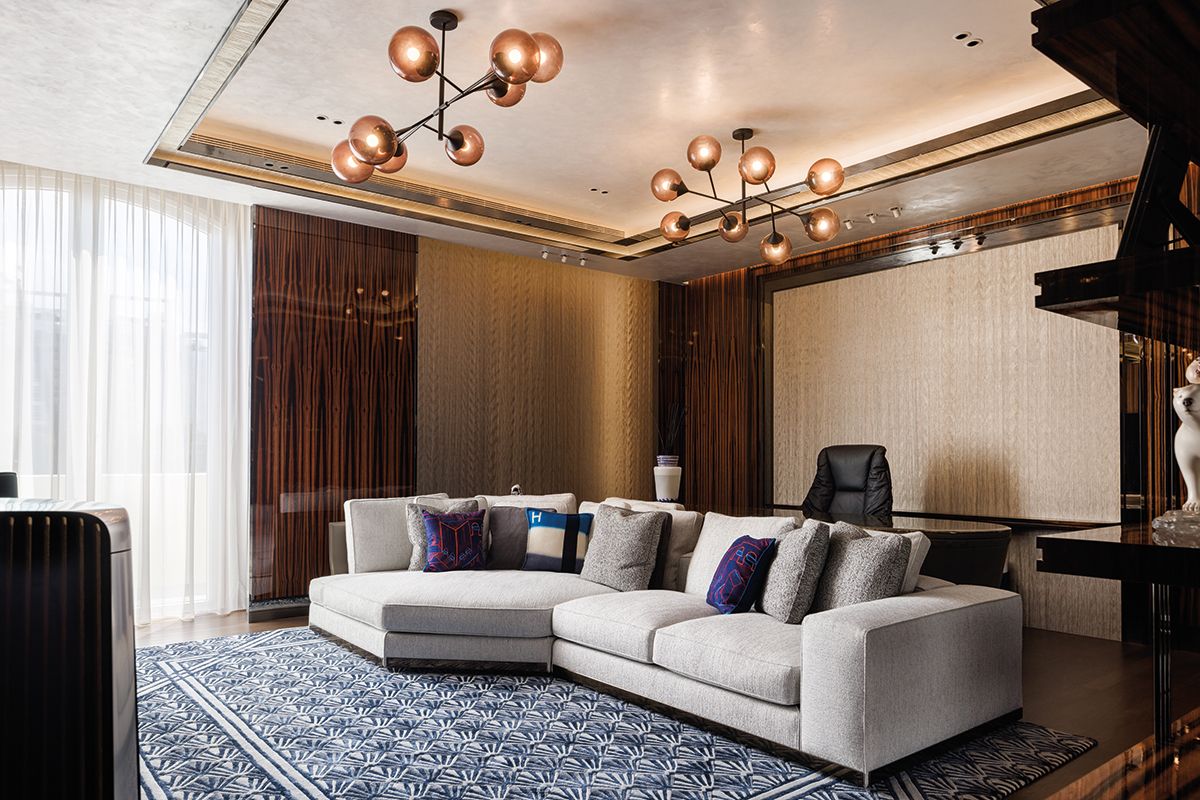 The husband’s study features the Minotti West sofa and Giorgetti Kendama lamps