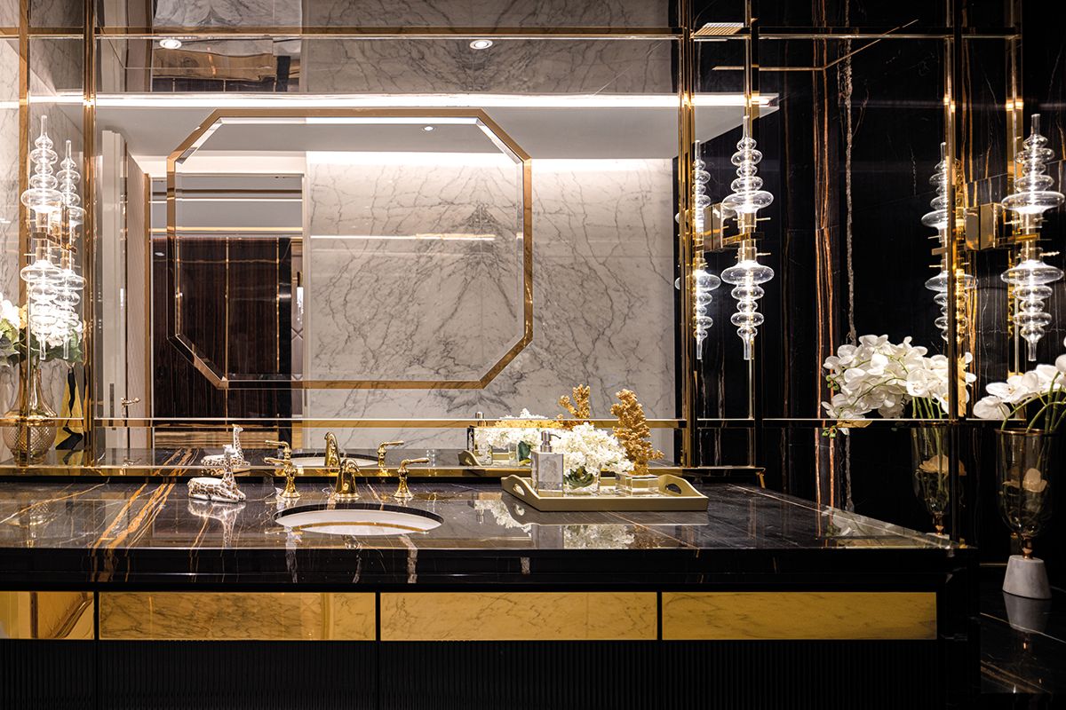The made-in-Italy Reflex wall lamps stand in contrast to the other angular forms in this beautiful powder room